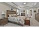 Relaxing main bedroom with neutral color palette, wood furniture, and lots of natural light at 500 Cottonwood Cir, Peachtree City, GA 30269
