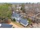 Aerial view of a gray home with a lake in the background, surrounded by lush trees at 600 Lake Overlook Dr, Canton, GA 30114