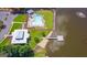 Aerial view of community pool, lake access with dock, and surrounding green space at 600 Lake Overlook Dr, Canton, GA 30114
