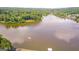 Magnificent aerial view showcasing a sprawling lake surrounded by lush landscapes and luxury homes at 600 Lake Overlook Dr, Canton, GA 30114