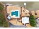 Stunning aerial view of a lakefront property featuring a covered pool and private dock at 600 Lake Overlook Dr, Canton, GA 30114