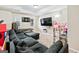 Basement area featuring a large couch, TV, and dart board, and toys at 600 Lake Overlook Dr, Canton, GA 30114