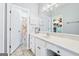 Bathroom featuring a long countertop with a sink and a mirror, plus doorways to other rooms at 600 Lake Overlook Dr, Canton, GA 30114