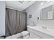 Bathroom with vanity and shower featuring a neutral color palette at 600 Lake Overlook Dr, Canton, GA 30114