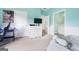 Comfortable bedroom with white dresser, tv, and an ensuite bathroom, perfect for relaxation at 600 Lake Overlook Dr, Canton, GA 30114