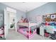 Bedroom featuring a bunk bed and a desk, with view looking out to another room through a doorway at 600 Lake Overlook Dr, Canton, GA 30114