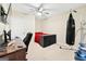 Bedroom features a ceiling fan, bed, desk, and exercise area at 600 Lake Overlook Dr, Canton, GA 30114