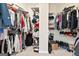 Spacious walk-in closet featuring lots of shelving with an abundance of clothes, shoes, and other personal items at 600 Lake Overlook Dr, Canton, GA 30114