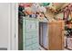 A closet with a mirror door is jam-packed with personal belongings, including stuffed animals, clothes, and suitcases at 600 Lake Overlook Dr, Canton, GA 30114
