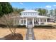 Charming exterior view of a bright, inviting lake house with a cozy porch at 600 Lake Overlook Dr, Canton, GA 30114