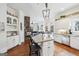 Gourmet kitchen with island, granite counters, stainless appliances, and open to Gathering room at 600 Lake Overlook Dr, Canton, GA 30114