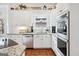 Bright kitchen featuring granite countertops, stainless appliances, and ample cabinet space at 600 Lake Overlook Dr, Canton, GA 30114