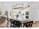 Open kitchen features a large center island with breakfast bar seating and modern pendant lighting at 600 Lake Overlook Dr, Canton, GA 30114