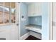 Mud room with access to the backyard, features built-in desk and cabinet storage at 600 Lake Overlook Dr, Canton, GA 30114