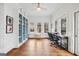 Bright office features built-in shelving, hardwood floors, and three large windows at 600 Lake Overlook Dr, Canton, GA 30114