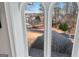 Window view showcasing lush greenery and a serene neighborhood landscape at 600 Lake Overlook Dr, Canton, GA 30114