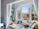 Window seat with window and curtains looking out over a lake and neighborhood in the background at 600 Lake Overlook Dr, Canton, GA 30114