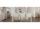 Kitchen with large island, stainless steel appliances, and bar seating at 604 Parnassus Rd, Locust Grove, GA 30248