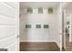 Open walk-in closet featuring shelving and hardwood floors at 604 Parnassus Rd, Locust Grove, GA 30248