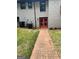 A backyard with brick and green grass at 3132 Riders Trl, Decatur, GA 30034