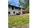 A backyard with brick and green grass at 3132 Riders Trl, Decatur, GA 30034