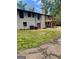 A backyard with brick and green grass at 3132 Riders Trl, Decatur, GA 30034