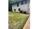 A backyard with brick and green grass at 3132 Riders Trl, Decatur, GA 30034