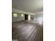 Large basement featuring finished floors, windows for natural light, and a modern fireplace at 3132 Riders Trl, Decatur, GA 30034