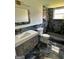 A modern bathroom with marble tile, granite bench, and gold fixtures at 3132 Riders Trl, Decatur, GA 30034