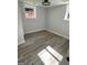 Cozy bedroom featuring new hardwood flooring, freshly painted walls, and natural light from multiple windows at 3132 Riders Trl, Decatur, GA 30034