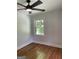 The bright bedroom offers natural light through a window and boasts elegant hardwood flooring at 3132 Riders Trl, Decatur, GA 30034