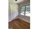 This bedroom has hardwood floors, a window with natural light, and a closet for storage at 3132 Riders Trl, Decatur, GA 30034