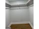 This is a walk-in closet with new shelving and hardwood floors at 3132 Riders Trl, Decatur, GA 30034