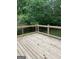 Newly constructed wooden deck perfect for outdoor entertaining, overlooking a lush green backyard at 3132 Riders Trl, Decatur, GA 30034