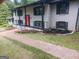 Close up of the exterior showing a brick walkway leading to a bright, updated home at 3132 Riders Trl, Decatur, GA 30034