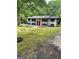 Beautiful exterior view of the brick home with a well manicured lawn and landscape at 3132 Riders Trl, Decatur, GA 30034