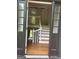 Open foyer with a wooden staircase, hardwood floors and plenty of natural light at 3132 Riders Trl, Decatur, GA 30034