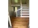 Elegant foyer with wood floors and open staircase to second level with landing at 3132 Riders Trl, Decatur, GA 30034