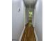 Hallway with hardwood floors and neutral paint at 3132 Riders Trl, Decatur, GA 30034