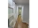 This hallway has hardwood floors and a modern sliding barn door feature to the side at 3132 Riders Trl, Decatur, GA 30034
