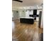 Bright kitchen boasts a large island, stainless appliances, and stylish black and white cabinets at 3132 Riders Trl, Decatur, GA 30034