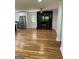 Open concept living room with hardwood floors, a kitchen with stainless steel appliances, and a fireplace at 3132 Riders Trl, Decatur, GA 30034