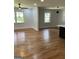 Spacious open-concept living room featuring hardwood floors and large windows at 3132 Riders Trl, Decatur, GA 30034