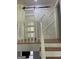 Stylish staircase with wooden steps and a decorative sliding barn door adding character to the upper level at 3132 Riders Trl, Decatur, GA 30034