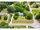 An aerial shot of the property and surrounding neighborhood showing the lawn and mature trees at 41 Ridgewood Cir, Mcdonough, GA 30252