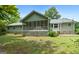 Charming home featuring a screened porch and a well-maintained backyard, blending indoor and outdoor living at 41 Ridgewood Cir, Mcdonough, GA 30252