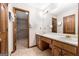 Bathroom featuring double sinks, tile flooring, and a walk-in shower at 41 Ridgewood Cir, Mcdonough, GA 30252