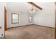 Spacious primary bedroom with ceiling fan, two windows, and neutral carpet at 41 Ridgewood Cir, Mcdonough, GA 30252