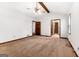Primary bedroom with a ceiling fan, wood beam, carpet, and two entry doors at 41 Ridgewood Cir, Mcdonough, GA 30252