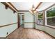 Bright dining room with wood floors, chandelier, and a large window at 41 Ridgewood Cir, Mcdonough, GA 30252
